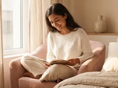 Woman sitting on a windowsill